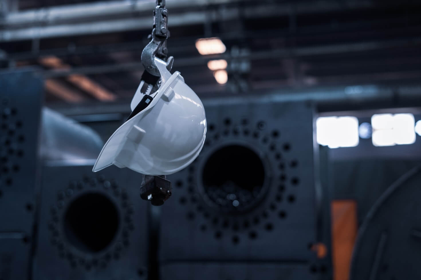 Construction safety helmet hanging from a hook